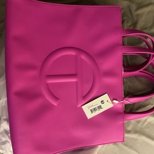 Medium Azalea Pink Telfar Bag selling for college books